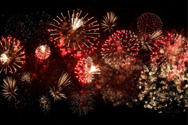 Red and white fireworks in the night sky